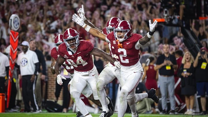 Sep 28, 2024; Tuscaloosa, Alabama, USA; Alabama Crimson Tide defensive back Zabien Brown (2) and linebacker Que Robinson (34) celebrate after an interception against the Georgia Bulldogs in the fourth quarter at Bryant-Denny Stadium. Mandatory Credit: Will McLelland-Imagn Images