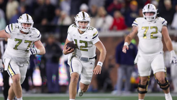Nov 21, 2024; Atlanta, Georgia, USA; Georgia Tech Yellow Jackets quarterback Aaron Philo (12) runs the ball for a touchdown against the North Carolina State Wolfpack in the fourth quarter at Bobby Dodd Stadium at Hyundai Field. Mandatory Credit: Brett Davis-Imagn Images