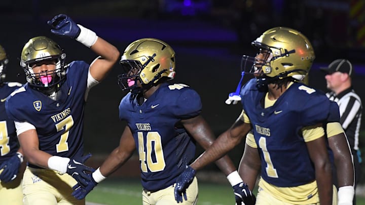 Spartanburg Vikings Trenton Lynch (40) celebrates with Spartanburg Vikings Tryon Duncan (7) and Spartanburg Vikings Torrean Davis (1) after scoring a touchdown Friday, Sept. 5, 2025 during the SCHSL football game against the Broome Centurions at Spartanburg High School in Spartanburg, South Carolina.