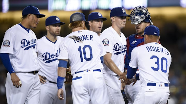 Sep 21, 2018; Los Angeles, CA, USA; Los Angeles Dodgers starting pitcher Ross Stripling (third from right) is taken out of the game by manager Dave Roberts during the fourth inning against the San Diego Padres at Dodger Stadium. Sep 21, 2018; Los Angeles, CA, USA; Los Angeles Dodgers starting pitcher Ross Stripling (third from right) is taken out of the game by manager Dave Roberts during the fourth inning against the San Diego Padres at Dodger Stadium.