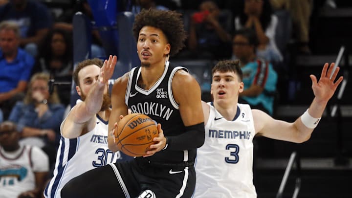 Oct 30, 2024; Memphis, Tennessee, USA; Brooklyn Nets forward Jalen Wilson (22) passes the ball as Memphis Grizzlies center Jay Huff (30) and forward Jake LaRavia (3) defend during the second half at FedExForum. Mandatory Credit: Petre Thomas-Imagn Images Oct 30, 2024; Memphis, Tennessee, USA; Brooklyn Nets forward Jalen Wilson (22) passes the ball as Memphis Grizzlies center Jay Huff (30) and forward Jake LaRavia (3) defend during the second half at FedExForum. Mandatory Credit: Petre Thomas-Imagn Images