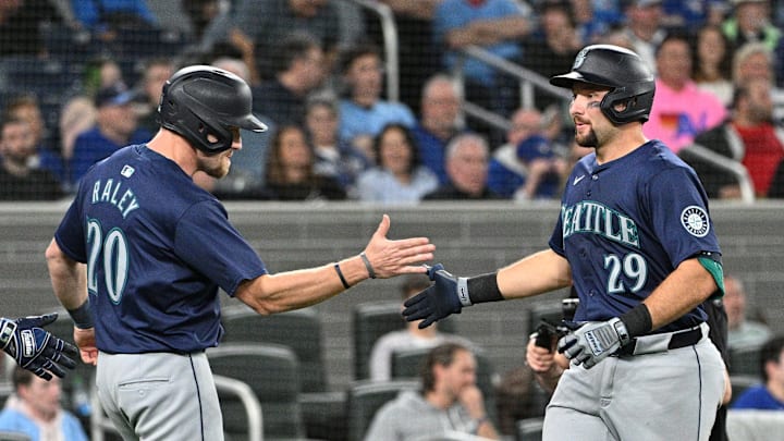 Apr 10, 2024; Toronto, Ontario, CAN; Seattle Mariners catcher Cal Raleigh (29) is greeted by Luke Raley (20). Apr 10, 2024; Toronto, Ontario, CAN; Seattle Mariners catcher Cal Raleigh (29) is greeted by Luke Raley (20).