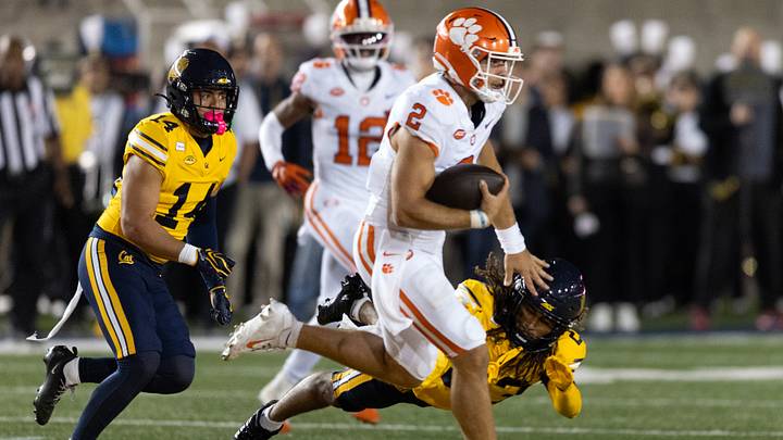 Sep 25, 2026; Berkeley, California, USA; Clemson Tigers quarterback Tait Reynolds (2) eludes a tackle by California Golden Bears defensive back Isaiah Crosby (23) during the second quarter at California Memorial Stadium. Mandatory Credit: D. Ross Cameron-Imagn Images Sep 25, 2026; Berkeley, California, USA; Clemson Tigers quarterback Tait Reynolds (2) eludes a tackle by California Golden Bears defensive back Isaiah Crosby (23) during the second quarter at California Memorial Stadium. Mandatory Credit: D. Ross Cameron-Imagn Images