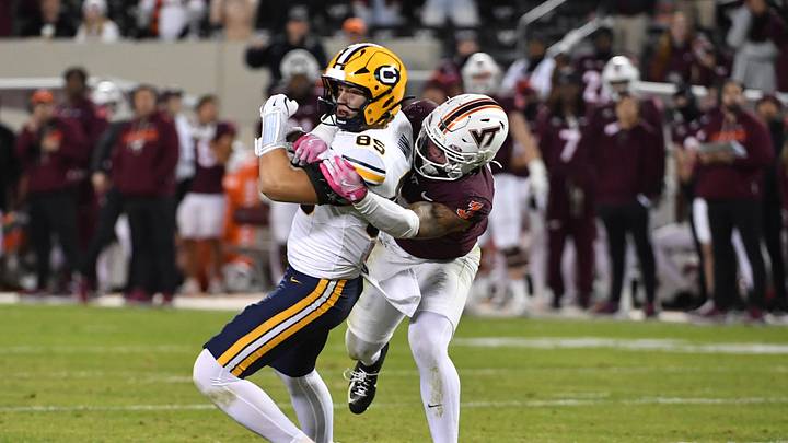 Oct 24, 2025; Blacksburg, Virginia, USA;  Virginia Tech Hokies linebacker Kaleb Spencer (3) tackles California Golden Bears tight end Mason Mini (85) after a catch during the fourth quarter at Lane Stadium. Mandatory Credit: Brian Bishop-Imagn Images