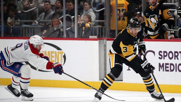 Nov 2, 2024; Pittsburgh, Pennsylvania, USA;  Pittsburgh Penguins defenseman Jack St. Ivany (3) moves the puck ahead of Montreal Canadiens defenseman Mike Matheson (8) during the third period at PPG Paints Arena. Mandatory Credit: Charles LeClaire-Imagn Images