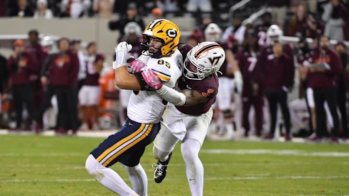 Oct 24, 2025; Blacksburg, Va.; Virginia Tech linebacker Kaleb Spencer (3) tackles California tight end Mason Mini (85) after a catch.