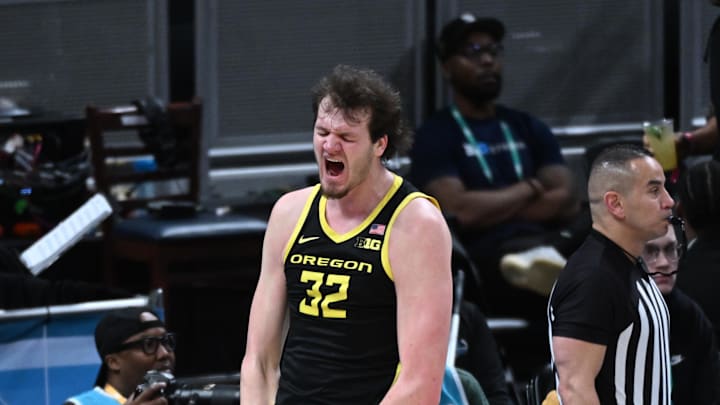 Mar 14, 2025; Indianapolis, IN, USA; Oregon Ducks center Nate Bittle (32) celebrates after a play during the second half against the Michigan State Spartans at Gainbridge Fieldhouse. Mandatory Credit: Robert Goddin-Imagn Images