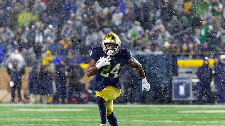 Nov 8, 2025; South Bend, Indiana, USA; Notre Dame Fighting Irish running back Jadarian Price (24) runs the ball against the Navy Midshipmen during the second half at Notre Dame Stadium. Mandatory Credit: Michael Caterina-Imagn Images