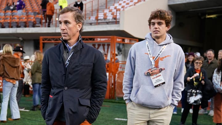 Nov 12, 2022; Austin, Texas, USA; Texas Longhorns quarterback recruit Arch Manning along with his father Cooper Manning on the sidelines before the game against the Texas Christian Horned Frogs at Darrell K Royal-Texas Memorial Stadium. Mandatory Credit: Scott Wachter-Imagn Images