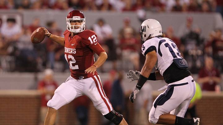 Oklahoma Sooners quarterback Landry Jones (12) is pressured in the pocket by Utah State Aggies linebacker Junior Keiaho (13) in the third quarter at Memorial Stadium. The Sooners beat the Aggies 31-24. Oklahoma Sooners quarterback Landry Jones (12) is pressured in the pocket by Utah State Aggies linebacker Junior Keiaho (13) in the third quarter at Memorial Stadium. The Sooners beat the Aggies 31-24.