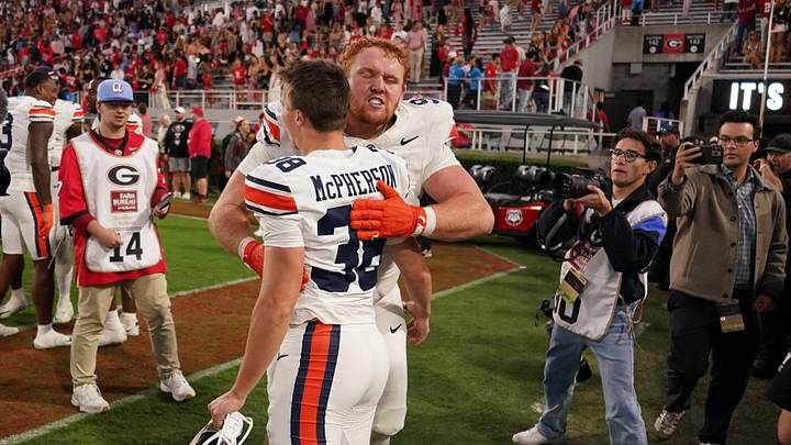 Oct 17, 2026; Athens, Georgia, USA; Auburn defensive lineman Cody Sigler (94) celebrates with Auburn kicker Alex McPherson (38) following a win over Georgia at Sanford Stadium. Mandatory Credit: Dale Zanine-Imagn Images Oct 17, 2026; Athens, Georgia, USA; Auburn defensive lineman Cody Sigler (94) celebrates with Auburn kicker Alex McPherson (38) following a win over Georgia at Sanford Stadium. Mandatory Credit: Dale Zanine-Imagn Images