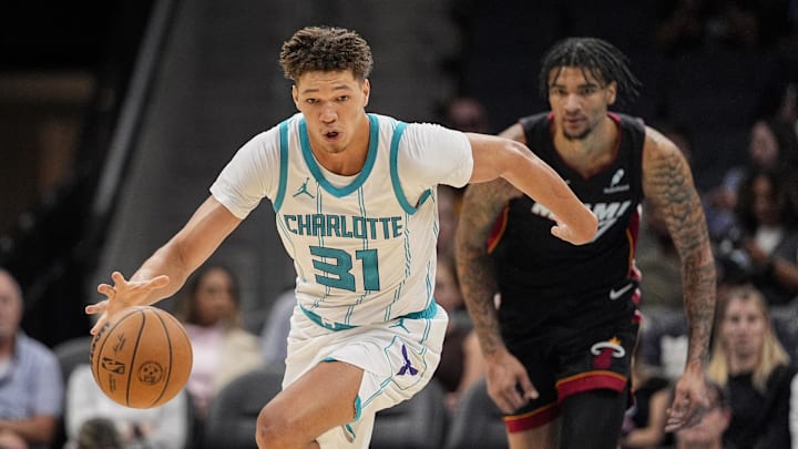 Oct 8, 2024; Charlotte, North Carolina, USA; Charlotte Hornets forward Tidjane Salaun (31) brings the ball up court after a steal against the Miami Heat during the second half at Spectrum Center. Mandatory Credit: Jim Dedmon-Imagn Images