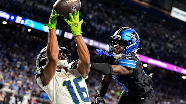 Detroit Lions cornerback Terrion Arnold (0) breaks a pass intended for Seattle Seahawks wide receiver Tyler Lockett (16) during the second half at Ford Field in Detroit on Monday, Sept. 30, 2024.