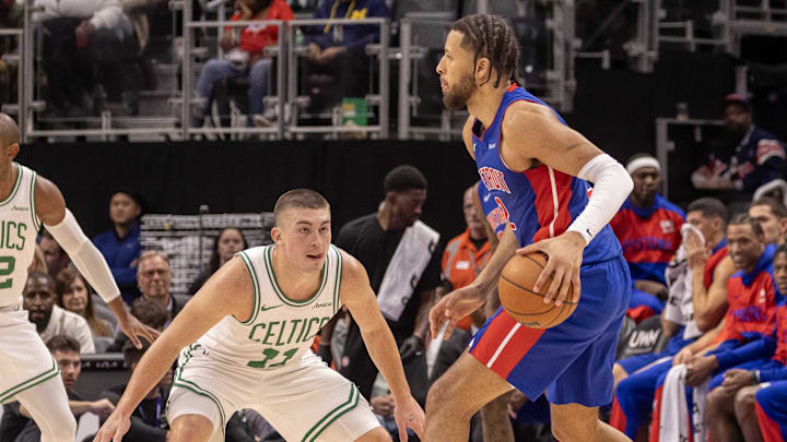 Oct 26, 2024; Detroit, Michigan, USA; Boston Celtics guard Payton Pritchard (11) defends against Detroit Pistons guard Cade Cunningham (2) during the in the first half at Little Caesars Arena. Mandatory Credit: David Reginek-Imagn Images
