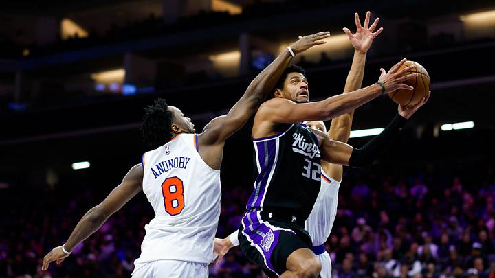 Jan 14, 2026; Sacramento, California, USA; Sacramento Kings center Dylan Cardwell (32) drives to the basket against New York Knicks forward Og Anunoby (8) during the fourth quarter at Golden 1 Center. Mandatory Credit: Sergio Estrada-Imagn Images Jan 14, 2026; Sacramento, California, USA; Sacramento Kings center Dylan Cardwell (32) drives to the basket against New York Knicks forward Og Anunoby (8) during the fourth quarter at Golden 1 Center. Mandatory Credit: Sergio Estrada-Imagn Images