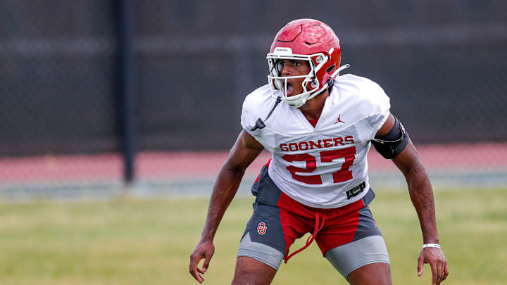 Jayden Rowe (27) runs drills during an OU football practice in Norman, Okla., on Monday, Aug. 7, 2023.