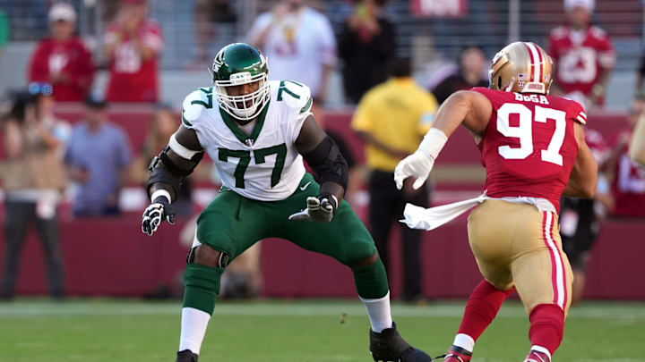 Sep 9, 2024; Santa Clara, California, USA; New York Jets offensive tackle Tyron Smith (77) blocks against San Francisco 49ers defensive end Nick Bosa (97) during the first quarter at Levi's Stadium. Mandatory Credit: Darren Yamashita-Imagn Images