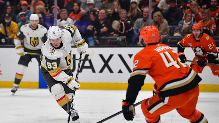 May 8, 2026; Anaheim, California, USA; Vegas Golden Knights right wing Mitch Marner (93) moves the puck against Anaheim Ducks center Tim Washe (42) during the first period in game three of the second round of the 2026 Stanley Cup Playoffs at Honda Center. Mandatory Credit: Gary A. Vasquez-Imagn Images