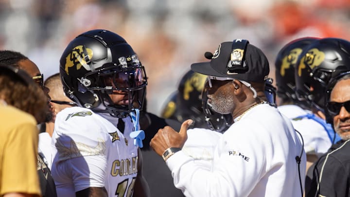 Colorado Buffalos wide receiver Travis Hunter and head coach Deion Sanders.
