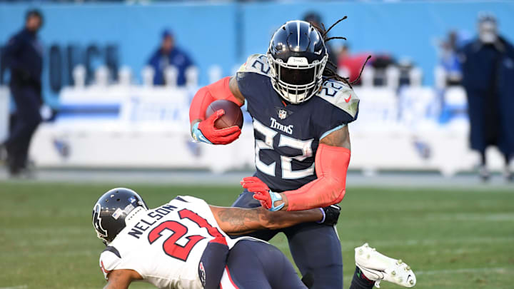 Dec 24, 2022; Nashville, Tennessee, USA; Tennessee Titans running back Derrick Henry (22) fights off