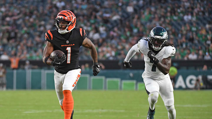 Aug 7, 2025; Philadelphia, Pennsylvania, USA; Cincinnati Bengals wide receiver Ja'Marr Chase (1) runs past Philadelphia Eagles cornerback Kelee Ringo (7) on a 36-yard touchdown catch during the first quarter against the Philadelphia Eagles at Lincoln Financial Field. Mandatory Credit: Eric Hartline-Imagn Images