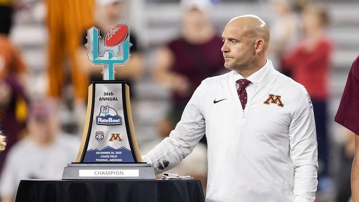 Dec 26, 2025; Phoenix, AZ, USA; Minnesota Gophers head coach P.J. Fleck with the trophy after defeating the New Mexico Lobos in overtime of the Rate Bowl at Chase Field. Mandatory Credit: Mark J. Rebilas-Imagn Images Dec 26, 2025; Phoenix, AZ, USA; Minnesota Gophers head coach P.J. Fleck with the trophy after defeating the New Mexico Lobos in overtime of the Rate Bowl at Chase Field. Mandatory Credit: Mark J. Rebilas-Imagn Images