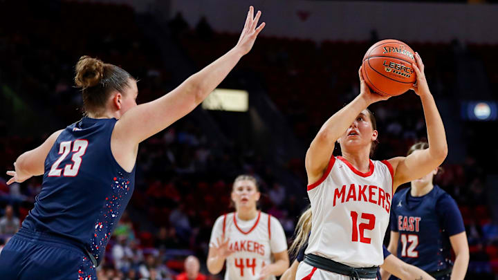 Kimberly High School's Kate McGinnis (12) pulls up for a shot against Appleton East High School during a WIAA Division 1 state semifinal on Friday, March 14, 2025, at the Resch Center in Ashwaubenon, Wis. McGinnis and the Makers play the Muskego Warriors for the Division 1 State Championship. Tork Mason/USA TODAY NETWORK-Wisconsin