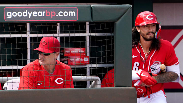 Cincinnati Reds manager David Bell (25) sits in the dugout as Cincinnati Reds second baseman Jonathan India (6) walks up the steps during a spring training game against the San Francisco Giants, Sunday, March 20, 2022, at Goodyear Ballpark in Goodyear, Ariz.

San Francisco Giants At Cincinnati Reds March 20 0037