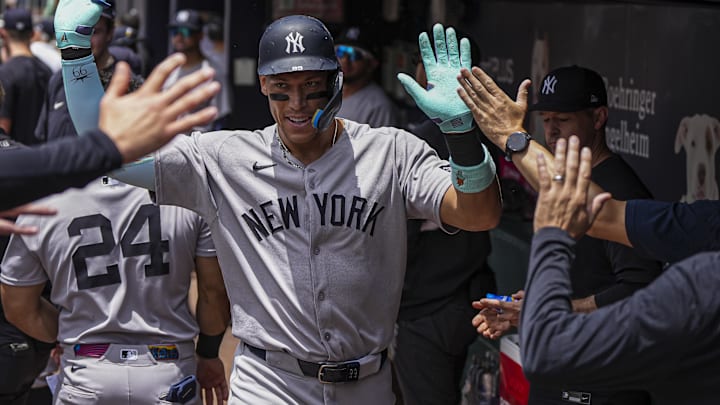 Jul 20, 2025; Cumberland, Georgia, USA; New York Yankees right fielder Aaron Judge (99) reacts in the dugout after hitting a home run against the Atlanta Braves during the first inning at Truist Park. Mandatory Credit: Dale Zanine-Imagn Images
