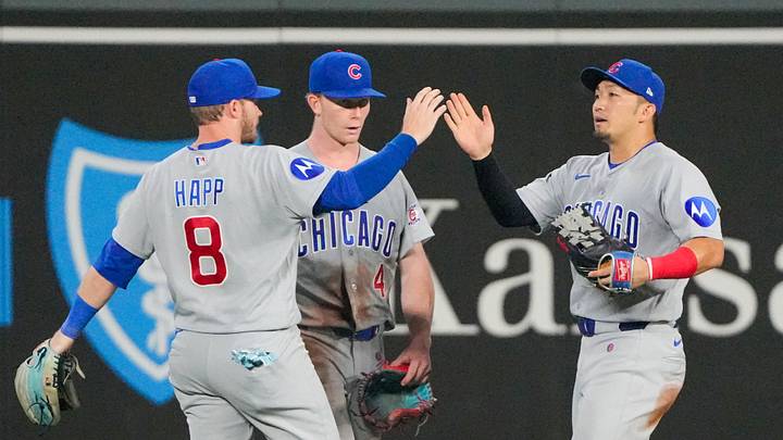 Aug 7, 2026; Kansas City, Missouri, USA; Chicago Cubs left fielder Ian Happ (8) and center fielder Pete Crow-Armstrong (4) and right fielder Seiya Suzuki (27) celebrate in the outfield after the win over the Kansas City Royals at Kauffman Stadium. Denny Medley-Imagn Images