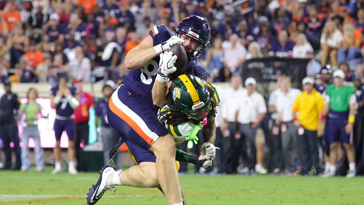 Sep 11, 2026; Charlottesville, Virginia, USA; Virginia Cavaliers tight end Willem Thurber (83) makes a catch as Norfolk State Spartans safety BJ Blake (0) defends during the fourth quarter at Scott Stadium. Mandatory Credit: Amber Searls-Imagn Images Sep 11, 2026; Charlottesville, Virginia, USA; Virginia Cavaliers tight end Willem Thurber (83) makes a catch as Norfolk State Spartans safety BJ Blake (0) defends during the fourth quarter at Scott Stadium. Mandatory Credit: Amber Searls-Imagn Images