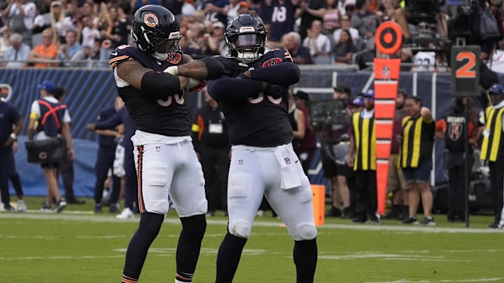 Sep 21, 2025; Chicago, Illinois, USA; Chicago Bears defensive end Montez Sweat (98) and defensive tackle Gervon Dexter Sr. (99) after sacking Dallas Cowboys quarterback Dak Prescott (not pictured) during the second half at Soldier Field. Mandatory Credit: David Banks-Imagn Images