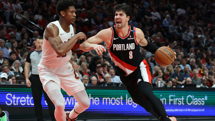 Mar 25, 2025; Portland, Oregon, USA; Portland Trail Blazers forward Deni Avdija (8) drives to the basket against Cleveland Cavaliers forward De'Andre Hunter (12) in the second half at Moda Center. Mandatory Credit: Jaime Valdez-Imagn Images