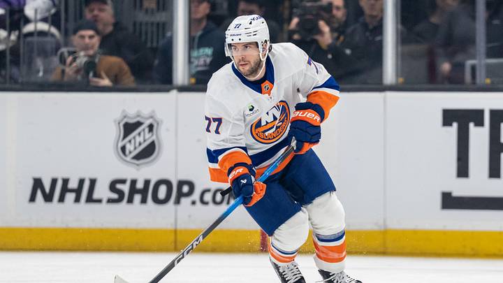 Jan 21, 2026; Seattle, Washington, USA; New York Islanders defenseman Tony DeAngelo (77) skates with the puck against the Seattle Kraken at Climate Pledge Arena. Mandatory Credit: Stephen Brashear-Imagn Images