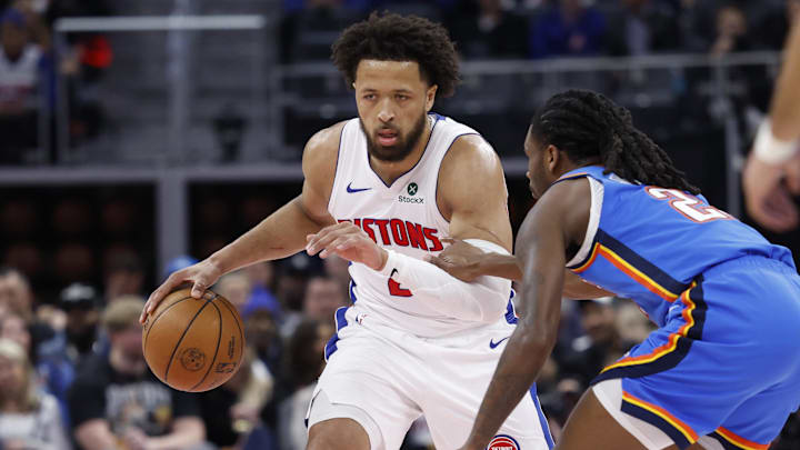 Feb 25, 2026; Detroit, Michigan, USA;  Detroit Pistons guard Cade Cunningham (2) dribbles defended by Oklahoma City Thunder guard Cason Wallace (22) in the first half at Little Caesars Arena. Mandatory Credit: Rick Osentoski-Imagn Images