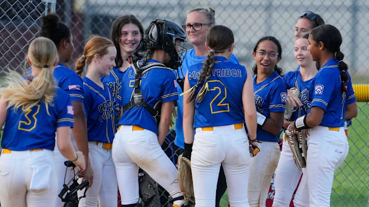 Camden-Wyoming's Alyssa Powell (third from right) is surrounded by her teammates after she started a double play by making a catch on a line drive and doubling up a Newark American-Canal runner in Camden-Wyoming's 18-0 win. Camden-Wyoming's Alyssa Powell (third from right) is surrounded by her teammates after she started a double play by making a catch on a line drive and doubling up a Newark American-Canal runner in Camden-Wyoming's 18-0 win.