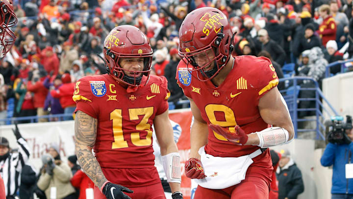 Dec 29, 2023; Memphis, TN, USA; Iowa State Cyclones wide receiver Jaylin Noel (13) and wide receiver Jayden Higgins (9) react after a touchdown during the first half against the Memphis Tigers at Simmons Bank Liberty Stadium. Mandatory Credit: Petre Thomas-Imagn Images
