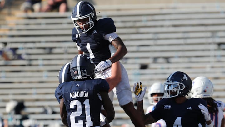 Aug 31, 2024; Statesboro, Georgia, USA; Georgia Southern Eagles wide receiver Dalen Cobb (1) celebrates with teammates after scoring a touchdown against the Boise State Broncos at Paulson Stadium. Mandatory Credit: Richard Burkhart/Savannah Morning News-Imagn Images Aug 31, 2024; Statesboro, Georgia, USA; Georgia Southern Eagles wide receiver Dalen Cobb (1) celebrates with teammates after scoring a touchdown against the Boise State Broncos at Paulson Stadium. Mandatory Credit: Richard Burkhart/Savannah Morning News-Imagn Images