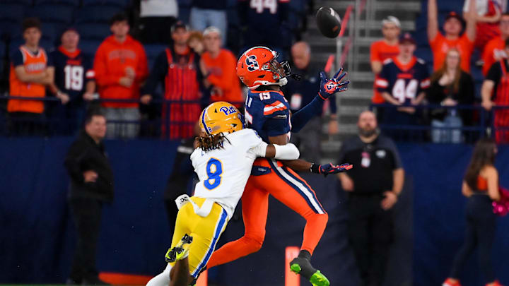 Oct 18, 2025; Syracuse, New York, USA; Pittsburgh Panthers defensive back Tamon Lynum (8) breaks up a pass intended for Syracuse Orange wide receiver Darrell Gill Jr. (15) during the second half at the JMA Wireless Dome. Mandatory Credit: Rich Barnes-Imagn Images