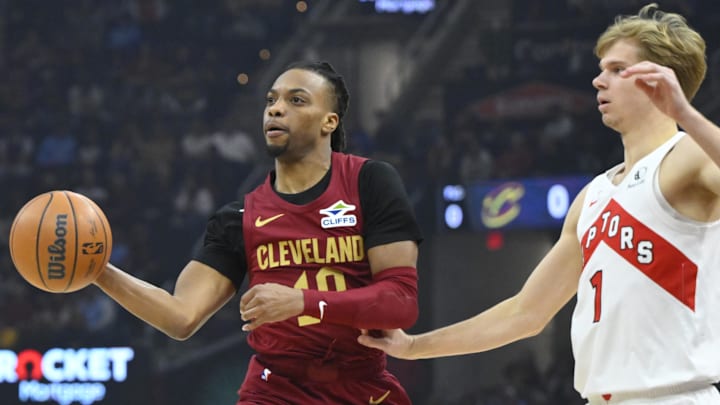 Jan 9, 2025; Cleveland, Ohio, USA; Cleveland Cavaliers guard Darius Garland (10) throws a pass beside Toronto Raptors guard Gradey Dick (1) in the first quarter at Rocket Mortgage FieldHouse. Mandatory Credit: David Richard-Imagn Images