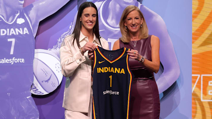Apr 15, 2024; Brooklyn, NY, USA; Caitlin Clark poses with WNBA commissioner Cathy Engelbert after being selected with the number one overall pick to the Indiana Fever during the 2024 WNBA Draft at the Brooklyn Academy of Music. Mandatory Credit: Brad Penner-Imagn Images