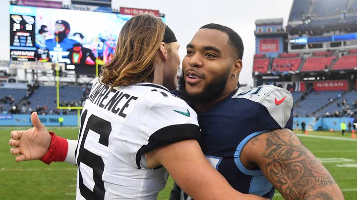 Dec 11, 2022; Nashville, Tennessee, USA; Jacksonville Jaguars quarterback Trevor Lawrence (16) and Tennessee Titans defensive tackle Jeffery Simmons (98) after a win by the Jaguars at Nissan Stadium. Mandatory Credit: Christopher Hanewinckel-USA TODAY Sports Dec 11, 2022; Nashville, Tennessee, USA; Jacksonville Jaguars quarterback Trevor Lawrence (16) and Tennessee Titans defensive tackle Jeffery Simmons (98) after a win by the Jaguars at Nissan Stadium. Mandatory Credit: Christopher Hanewinckel-USA TODAY Sports