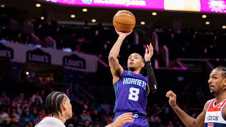 Mar 1, 2025; Charlotte, North Carolina, USA; Charlotte Hornets guard Nick Smith Jr. (8) shoots against the Washington Wizards during the first quarter at Spectrum Center. Mandatory Credit: Scott Kinser-Imagn Images