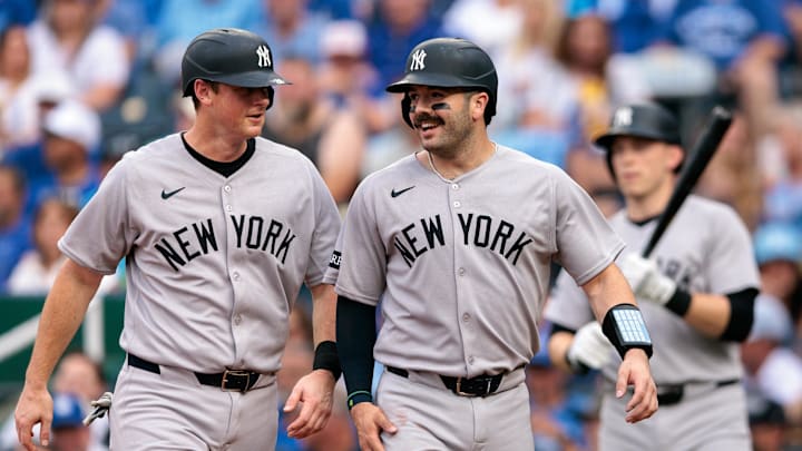 Jun 11, 2025; Kansas City, Missouri, USA; New York Yankees second base DJ LeMahieu (26) and New York Yankees catcher Austin Wells (28) celebrate after scoring during the second inning against the Kansas City Royals  at Kauffman Stadium. Mandatory Credit: William Purnell-Imagn Images