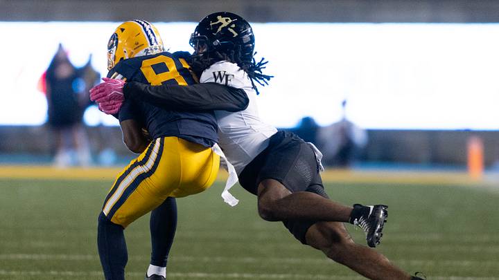Oct 17, 2026; Berkeley, California, USA;  Wake Forest Demon Deacons defensive back Deuce Blades II (right) brings down California Golden Bears wide receiver Tyree Sams (81) short of a first down during the first quarter at California Memorial Stadium.  Mandatory Credit: D. Ross Cameron-Imagn Images