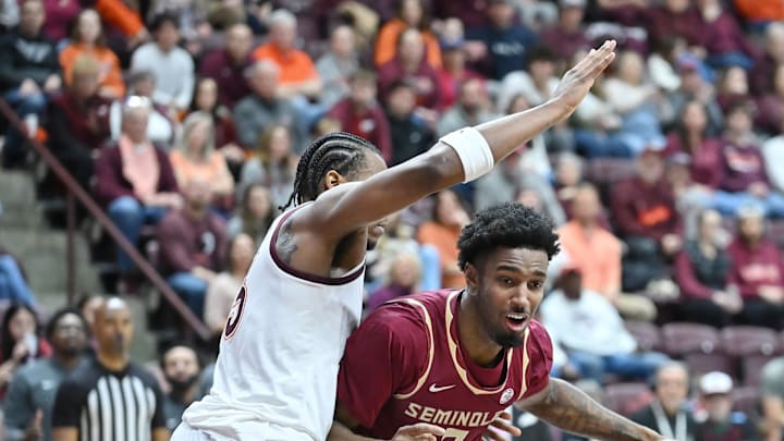 Feb 14, 2026; Blacksburg, Virginia, USA; Florida State Seminoles forward Chauncey Wiggins (7) dribbles against Virginia Tech Hokies forward Amani Hansberry (13) during the first half at Cassell Coliseum. Mandatory Credit: Brian Bishop-Imagn Images Feb 14, 2026; Blacksburg, Virginia, USA; Florida State Seminoles forward Chauncey Wiggins (7) dribbles against Virginia Tech Hokies forward Amani Hansberry (13) during the first half at Cassell Coliseum. Mandatory Credit: Brian Bishop-Imagn Images