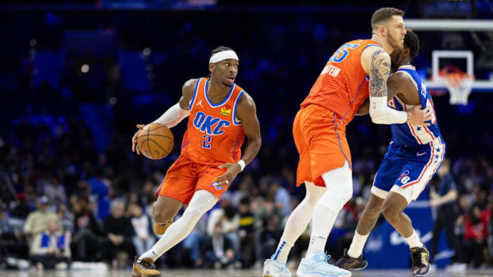 Jan 14, 2025; Philadelphia, Pennsylvania, USA; Oklahoma City Thunder guard Shai Gilgeous-Alexander (2) controls the ball against the Philadelphia 76ers during the fourth quarter at Wells Fargo Center. Mandatory Credit: Bill Streicher-Imagn Images