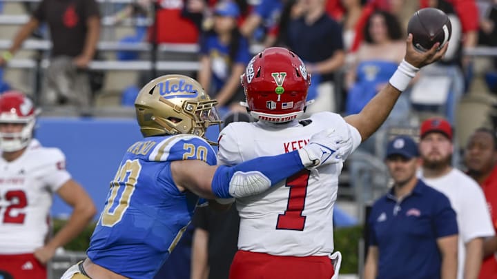 Nov 30, 2024; Pasadena, California, USA; UCLA Bruins linebacker Kain Medrano (20) hits Fresno State Bulldogs quarterback Mikey Keene (1) as he throws a pass during the second quarter at Rose Bowl. Mandatory Credit: Robert Hanashiro-Imagn Images Nov 30, 2024; Pasadena, California, USA; UCLA Bruins linebacker Kain Medrano (20) hits Fresno State Bulldogs quarterback Mikey Keene (1) as he throws a pass during the second quarter at Rose Bowl. Mandatory Credit: Robert Hanashiro-Imagn Images