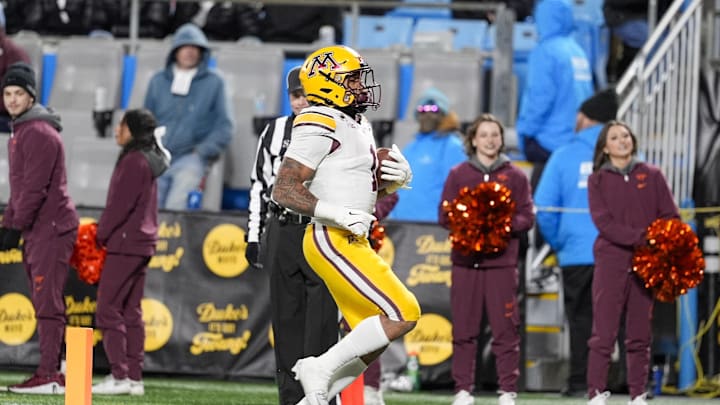 Jan 3, 2025; Charlotte, NC, USA; Minnesota Golden Gophers running back Darius Taylor (1) scores  a touchdown against the Virginia Tech Hokies during the second quarter at the Duke’s Mayo Bowl at Bank of America Stadium. Mandatory Credit: Jim Dedmon-Imagn Images