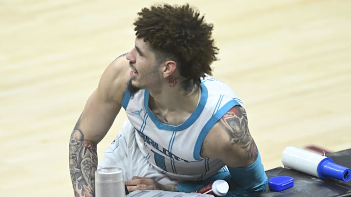 Jan 5, 2025; Cleveland, Ohio, USA; Charlotte Hornets guard LaMelo Ball (1) collides with the scorers table in the first quarter against the Cleveland Cavaliers at Rocket Mortgage FieldHouse. Mandatory Credit: David Richard-Imagn Images Jan 5, 2025; Cleveland, Ohio, USA; Charlotte Hornets guard LaMelo Ball (1) collides with the scorers table in the first quarter against the Cleveland Cavaliers at Rocket Mortgage FieldHouse. Mandatory Credit: David Richard-Imagn Images